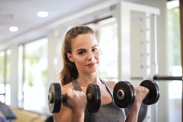 young woman dumbbell